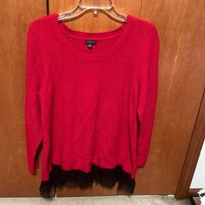 Cute Torrid red sweater with black lace on bottom.